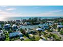 Coastal community featuring waterfront homes, tranquil canals, and ocean access at 6011 Emerald Harbor Dr, Longboat Key, FL 34228