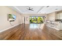 Bright living room with hardwood floors and access to a backyard view at 942 Preservation St, Bradenton, FL 34208