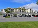 Condo building exterior with covered parking at 1010 Tidewater Shores Loop # 103, Bradenton, FL 34208