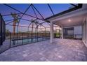 Screened-in pool and patio area, perfect for outdoor entertaining at 10426 Abaco Falls Dr, Englewood, FL 34223