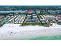 Aerial view showing the building's location near the beach at 1200 E Peppertree Ln # 307, Sarasota, FL 34242