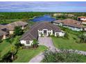Luxury home situated on a waterfront lot in a high-end community at 19405 Ganton Ave, Lakewood Ranch, FL 34202