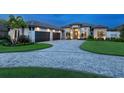 Stunning luxury home with a three-car garage and beautifully landscaped yard at 19405 Ganton Ave, Lakewood Ranch, FL 34202