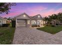 Stunning curb appeal, featuring a paver driveway and attractive facade at 4611 Shark Dr, Bradenton, FL 34208