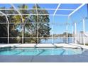 The pool in a screened enclosure with a peaceful lake view at 5307 52Nd W Ave, Bradenton, FL 34210