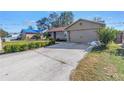 One story house with a two car garage and a long driveway at 6025 62Nd E Ct, Palmetto, FL 34221