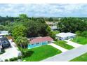 Aerial view of a teal home and surrounding neighborhood at 300 Coral Rd, Venice, FL 34293