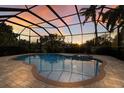 Relaxing pool and spa area with a covered lanai at 3618 Summerwind Cir, Bradenton, FL 34209