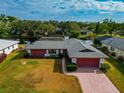 Bird's-eye view of a single-story home, showcasing its layout and canal location at 4423 Meadow Creek Cir, Sarasota, FL 34233