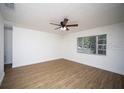 Spacious bedroom with light walls and wood floors at 1630 29Th St, Sarasota, FL 34234