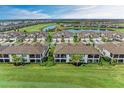 Community overview with golf course and lake views at 6055 Worsham Ln # 104, Lakewood Ranch, FL 34211