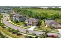 Aerial view of home in a cul-de-sac near an amenity center and a preserve at 6318 Anise Dr, Sarasota, FL 34238