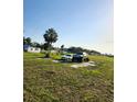 Wide lot with two vehicles, one large, and a single-story home in the background at 2815 Us-41 N, Palmetto, FL 34221