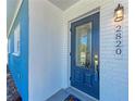 A close-up of the front door featuring decorative glass, adding a touch of elegance to the home's entrance at 2820 Wood St, Sarasota, FL 34237