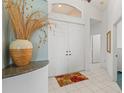 Bright and spacious entryway with tile flooring and double doors at 4311 65Th E Ter, Sarasota, FL 34243