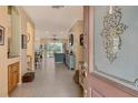 Bright and airy entryway with tile floors and view into living area at 6504 Copper Ridge Trl, Bradenton, FL 34201