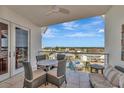 Outdoor seating on balcony provides the perfect place to relax and enjoy scenic views at 915 Seaside Dr # 604, Sarasota, FL 34242