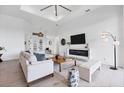Spacious living room with a modern fireplace and large windows at 0 Symco Ave, North Port, FL 34286
