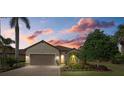 Single-story house with a two-car garage and well-manicured landscaping at 12606 Fontana Loop, Bradenton, FL 34211