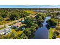 Aerial view showing home's location near canal and road at 1605 Alton Rd, Port Charlotte, FL 33952