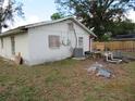 House exterior showcasing a white painted wall and AC unit at 1814 6Th E Ave, Bradenton, FL 34208