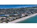 Aerial view of condo building near beach and waterway at 3240 Gulf Of Mexico Dr # B504, Longboat Key, FL 34228