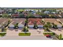 Bird's-eye view of villas near a lake and golf course at 3841 Albacete Cir # 51, Punta Gorda, FL 33950
