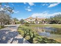 Impressive home with a pond and meticulously landscaped grounds at 6200 Saddle Oak Trl, Sarasota, FL 34241