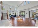 Spacious living room with hardwood floors, high ceilings, and ample natural light at 7242 Villa D Este Dr, Sarasota, FL 34238