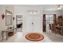 Bright and spacious foyer with tile floors and double doors at 22435 Panther Loop, Bradenton, FL 34202