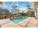 Relaxing screened pool and spa with a view of the backyard at 22435 Panther Loop, Bradenton, FL 34202