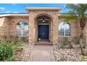 Brick entryway with a dark blue double door at 2957 Wilderness E Blvd, Parrish, FL 34219