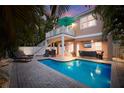 Inviting pool area with lounge chairs and outdoor seating at 312 61St St # B, Holmes Beach, FL 34217