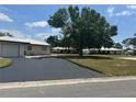 Charming single-story home with a well-maintained lawn and paved driveway at 430 Botticelli Dr # 430, Nokomis, FL 34275