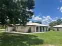 This single-story home boasts a white tile roof, neutral paint, and a well-maintained green lawn at 430 Botticelli Dr # 430, Nokomis, FL 34275