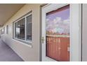 Apartment hallway with light-colored walls and a glass door at 4460 Ironwood Cir # 403A, Bradenton, FL 34209