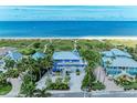 Breathtaking beachfront property with lush tropical landscaping and direct access to the Gulf of Mexico at 506 S Casey Key Rd, Nokomis, FL 34275