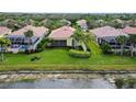 Property sits on a canal with a backyard pool and patio at 5759 Benevento Dr, Sarasota, FL 34238