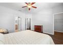 Main bedroom with plush bedding and ample closet space at 8003 Limestone Ln # 15-103, Sarasota, FL 34233