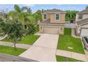 Two-story house, two-car garage, and neatly landscaped yard at 1964 Hawks View Dr, Ruskin, FL 33570