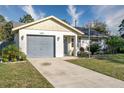 Single-story house with gray garage door and well-manicured lawn at 4532 N Shade Ave, Sarasota, FL 34234