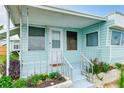 Charming single-story home with a cozy front porch and well-maintained landscaping at 604 49Th Avenue W Dr, Bradenton, FL 34207