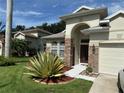 Beautiful home exterior with well-maintained landscaping and a stone-accented entrance at 3439 101St E Ave, Parrish, FL 34219