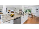 Modern kitchen with granite countertops and stainless steel appliances at 6308 Lilac Pl, Sarasota, FL 34231