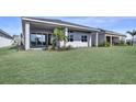 Spacious backyard with lush green grass, perfect for outdoor activities and entertaining at 17920 Palmiste Dr, Bradenton, FL 34202