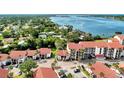 A ground-level shot of the building's exterior with private parking at 1626 Stickney Point Rd # 26-102, Sarasota, FL 34231