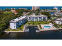 Waterfront condominium boasts private boat docks and community pool, with scenic water views at 605 Sutton Pl # 205, Longboat Key, FL 34228