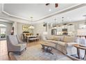 Inviting living room showcasing stylish furnishings, a dining area, with seamless flow into the well-appointed kitchen at 11422 Griffith Park Ter, Bradenton, FL 34211