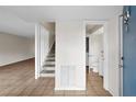 Inviting foyer with tile flooring, stairs, and half bathroom at 4001 Beneva Rd # 304, Sarasota, FL 34233