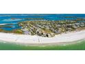 Stunning aerial view of beachside condos with pristine white sand and turquoise waters at 7155 Gulf Of Mexico Dr # 22, Longboat Key, FL 34228